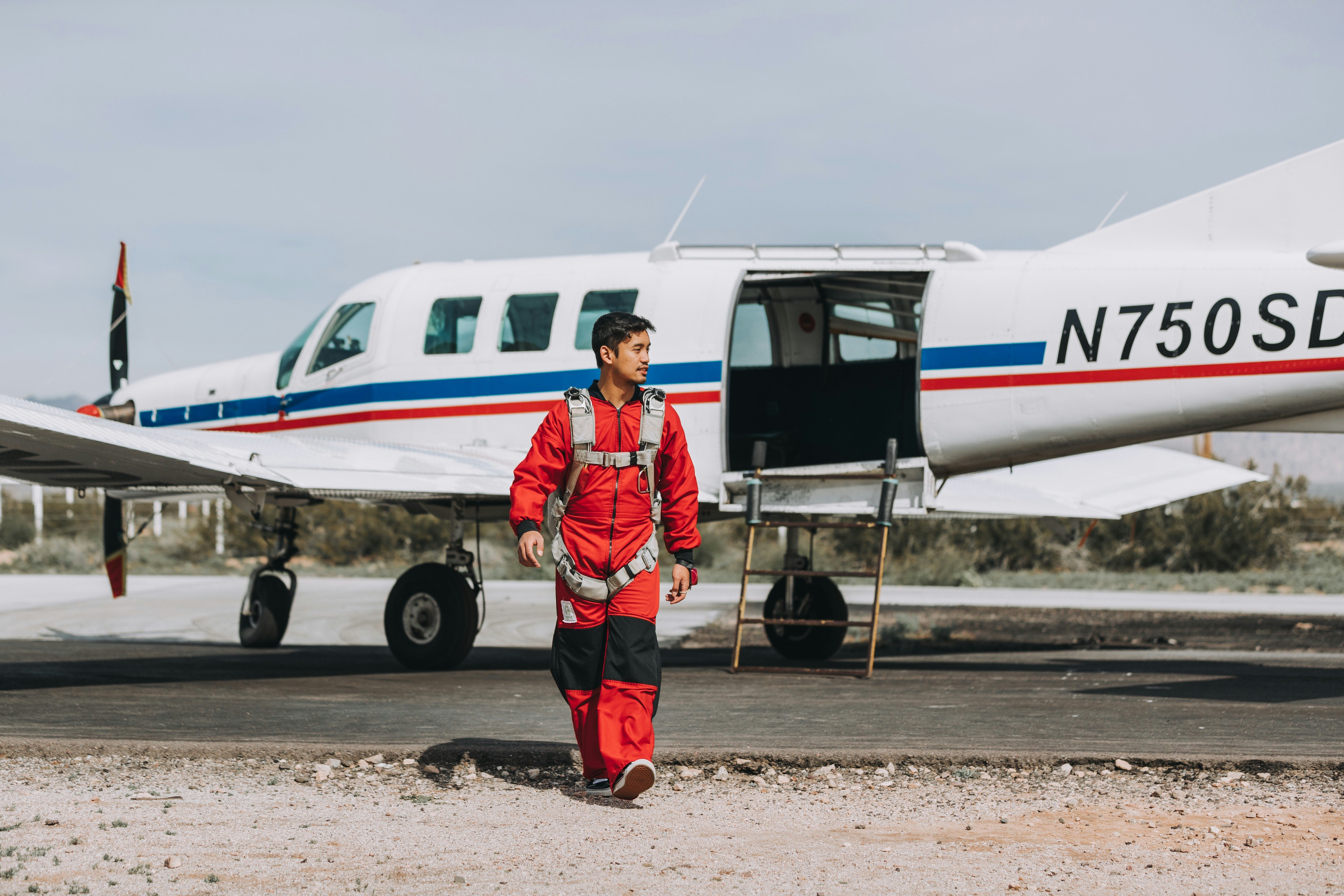 man walking near airplane